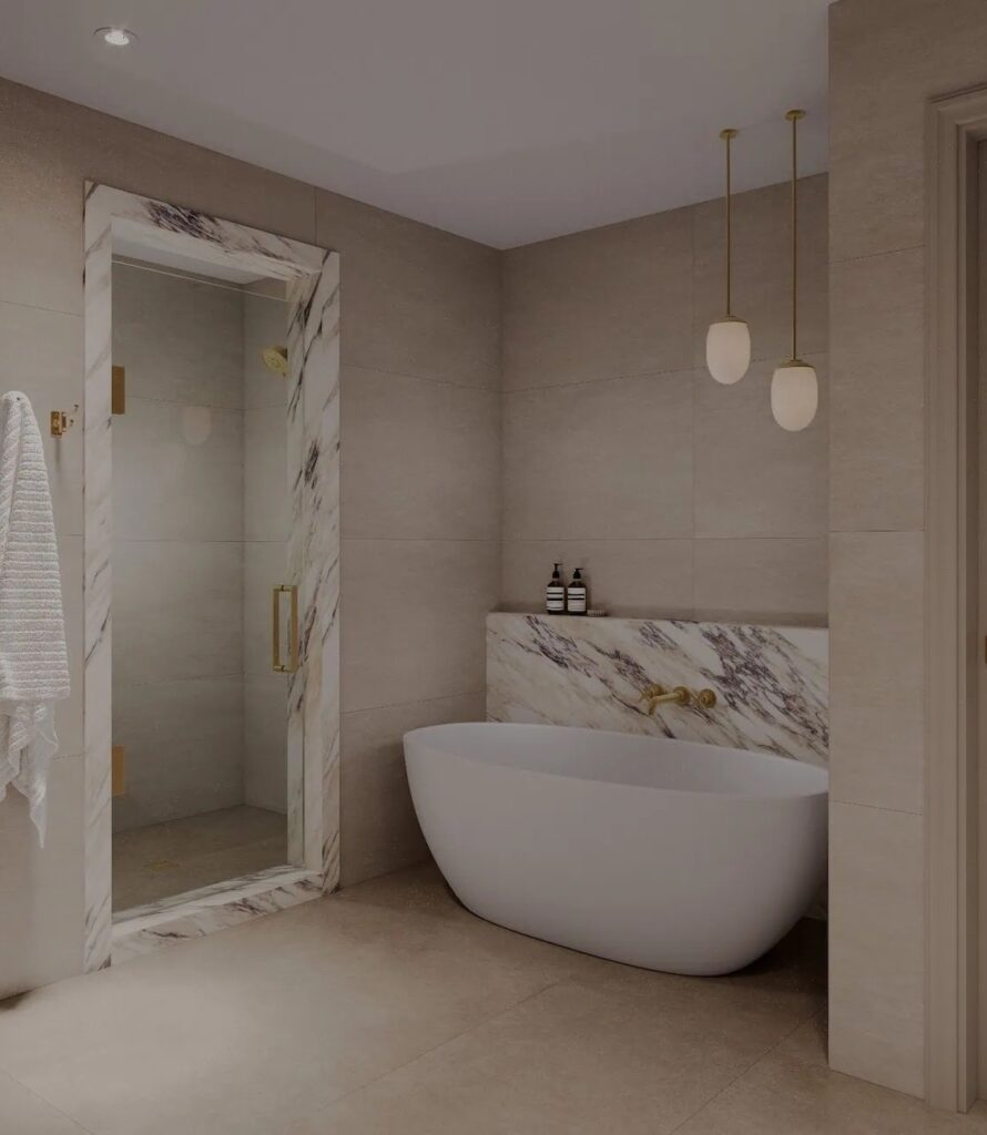 Freestanding tub, marble surround and a glass steam shower in a Hoboken waterfront condo bathroom.